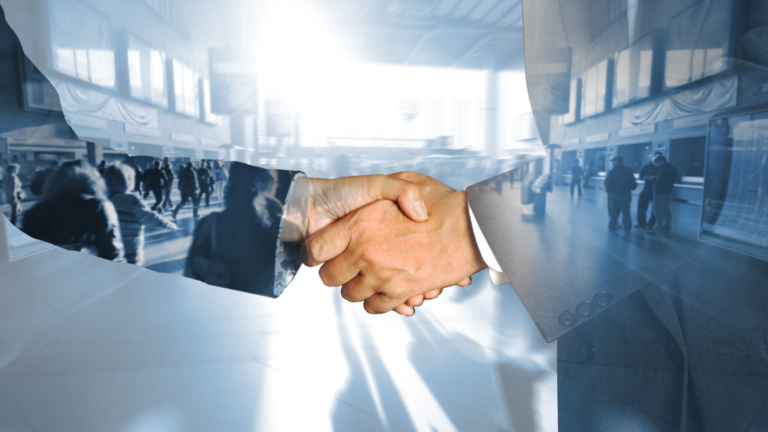 Two people shaking hands in business agreement
